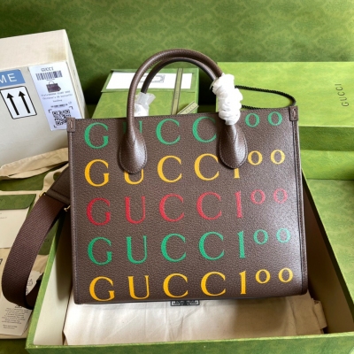 GUCCI古馳 GG100周年特別系列托特包這款結構挺括的小號托特包採用GG Supreme帆布製作，搭配棕色皮革滾邊，提供頂部提手和肩帶雙重攜帶選擇。型號：680956。尺寸：31*26.5*14cm。顏色：啡皮/塗鴉。配